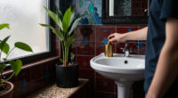 A Tiny Bathroom Went From Grimy To Cozy After A "Gothic-Aquatic" Redo
